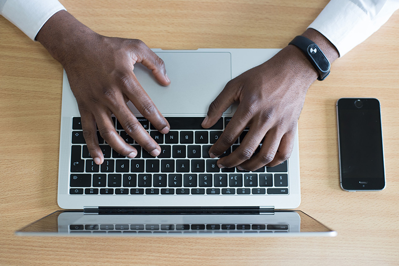 https://www.pexels.com/photo/closeup-photo-of-person-s-hands-on-macbook-beside-space-gray-iphone-5s-955402/